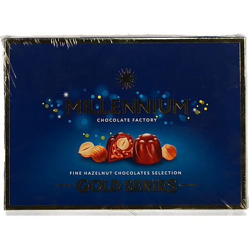 Цукерки шоколадні з горіховим праліне і цілим лісовим горіхом у молочному шоколаді Gold Millennium к/у 205г